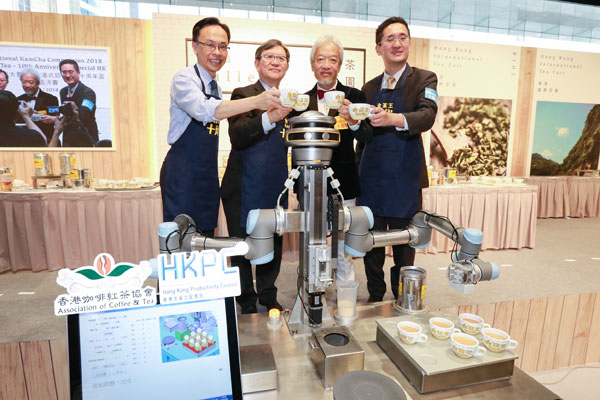 (Starting from left) Mr Patrick Nip, Secretary for Constitutional and Mainland Affairs; Mr Willy Lin, Chairman of HKPC; Mr Simon Wong, Chairman of ACT; and Dr Bernard Chan, Acting Secretary for Commerce and Economic Development, enjoy a cup of Hong Kong-style milk tea made by “KamChAI”