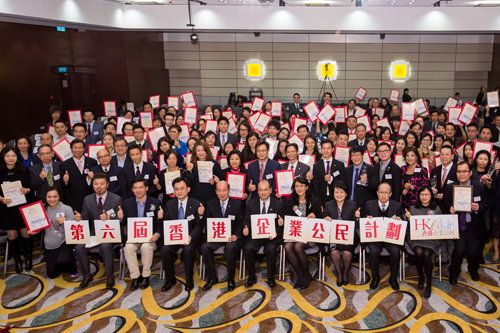 Officiating guests pose for a group photo with the “Corporate Citizenship Logo” recipients