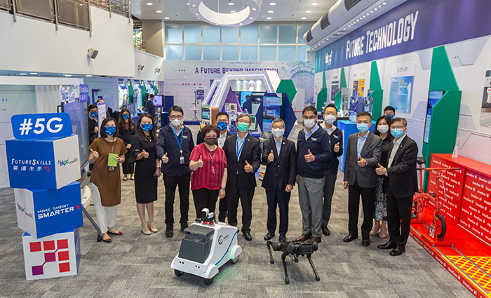 VTC Chairman Mr Tony Tai (sixth from right); Executive Director Mrs Carrie Yau (fourth from left); and Deputy Chairman Dr Daniel Yip (third from right) pose for a group photo with HKPC management, led by Chairman Mr Willy Lin (sixth from left) and Executive Director Mr Mohamed Butt (fifth from right) at the revamped 5G Future Hall.
