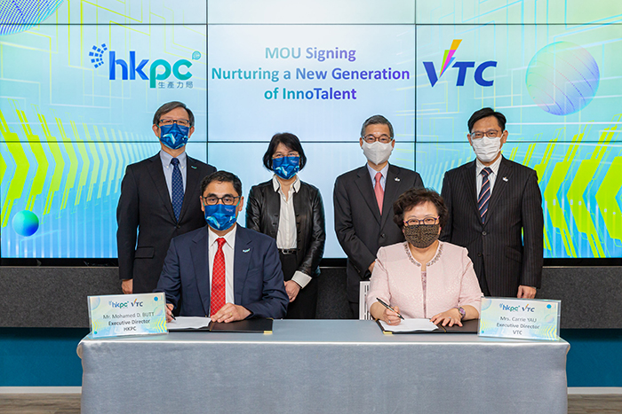 HKPC and VTC sign a MOU to jointly nurture a new generation of InnoTalent in Hong Kong. Witnessed by Ms Annie Choi, Permanent Secretary for Innovation and Technology of the HKSAR Government (back row, second from left); Mr Willy Lin, Chairman of HKPC (back row, first from left); Mr Tony Tai, Chairman of VTC (back row, second from right), and Mr Donald Tong, Executive Director Designate of VTC (back row, first from right), the MOU is signed by Mr Mohamed Butt, Executive Director of HKPC (front row, left), and Mrs Carrie Yau, Executive Director of VTC (front row, right)