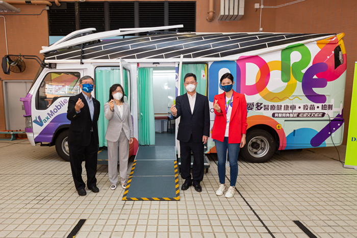 Mr Alfred Sit, Secretary for Innovation and Technology (second from right); Ms Rebecca Pun, Commissioner for Innovation and Technology (second from left); Ms Kimmy Lai, Founder of ADORE (first from right), and Mr Willy Lin, Chairman of HKPC (first from left), visited “VaxMobile”, an electric vehicle that was transformed into a mobile vaccination station.