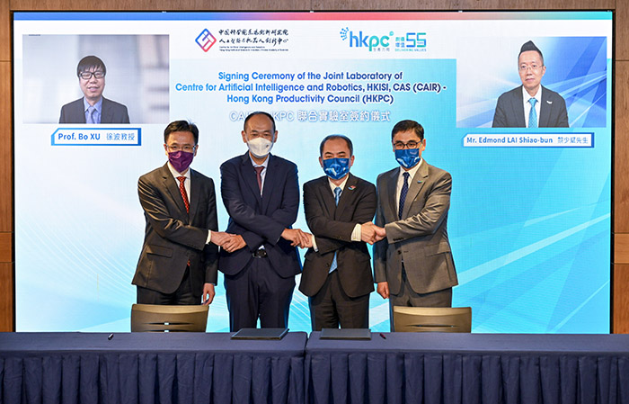 (From left) Dr Bo XU, Director of CAIR and President of Institute of Automation, Chinese Academy of Sciences; Prof. Dong SUN, Secretary for Innovation, Technology and Industry, HKSAR Government; Dr Hongbin LIU, Executive Director of CAIR; Dr Ming GE, General Manager of Robotics and Artificial Intelligence Division of HKPC, Mr Mohamed BUTT, Executive Director of HKPC and Mr Edmond LAI, Chief Digital Officer of HKPC, take a group photo to commemorate the establishment of the CAIR-HKPC Joint Lab.   